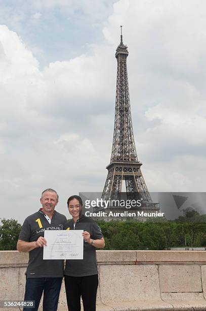 Former Tennis player and new Laureus Academy Member Li Na with Laureus Academy Member Sean Fitzpatrick pose with her certificate during the Li Na...