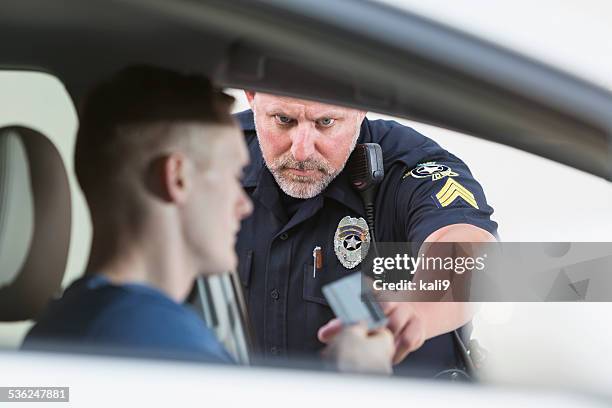 police officer making a traffic stop - drinking and driving stock pictures, royalty-free photos & images