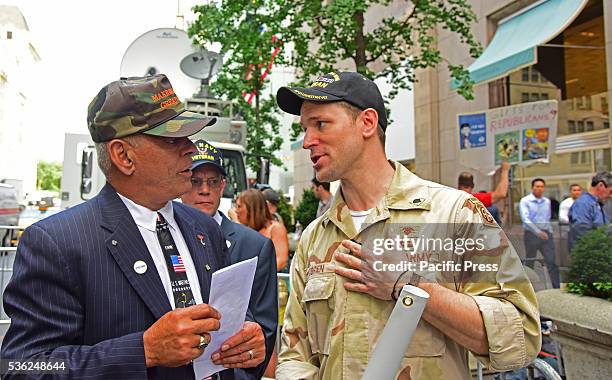 Pro & anti activists: Trump supporter Al Baldasaro chats with Trump opponent Terry O'Brien in front of Trump Tower. Pro and anti Trump activists...