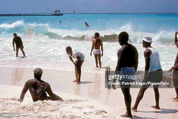 Cricket being played on the beach near Oistins on the South Coast, Barbados 11th March 1981.