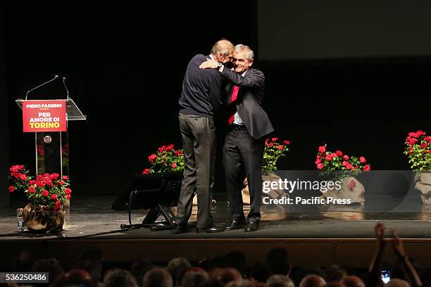The President of the Piedmont Region Sergio Chiamparino and Mayor Piero Fassino embrace, at the Teatro Alfieri, for the closing of the campaign of...