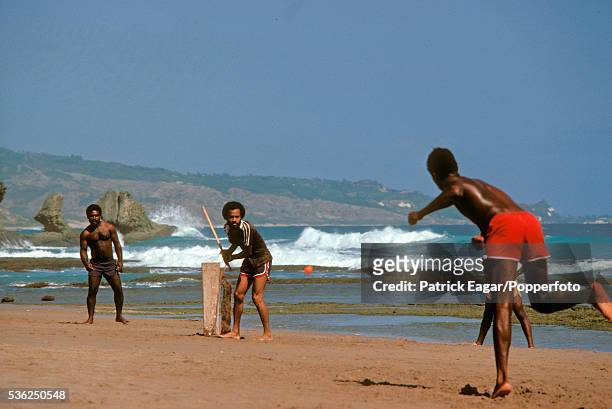 Cricket being played on the beach at Bathsheba, East Coast, Barbados 11th March 1981.