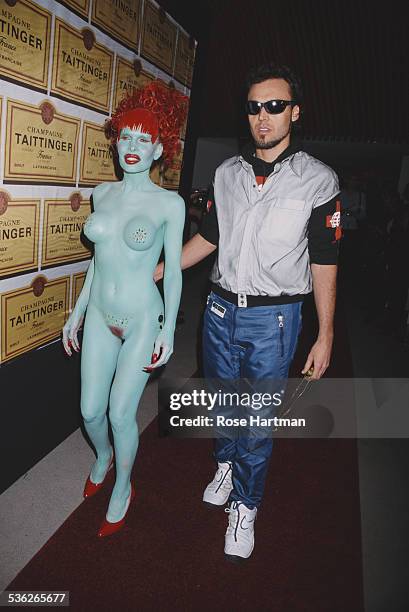 American photographer David LaChapelle and American model Amanda Lepore attend the 'Visionaire' magazine party, New York City, USA, 1998.