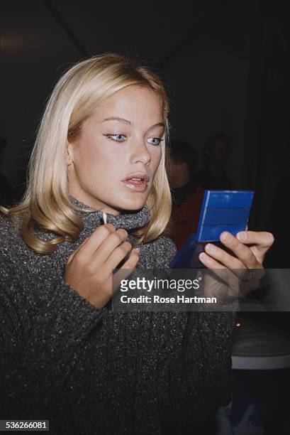 American model and actress Carolyn Murphy attends the Oscar de la Renta Fall 1999 fashion show, 1999.