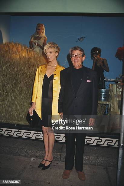 German-Australian photographer Helmut Newton and American model Kristen McMenamy at a party being held in Newton's honour in Barneys department...
