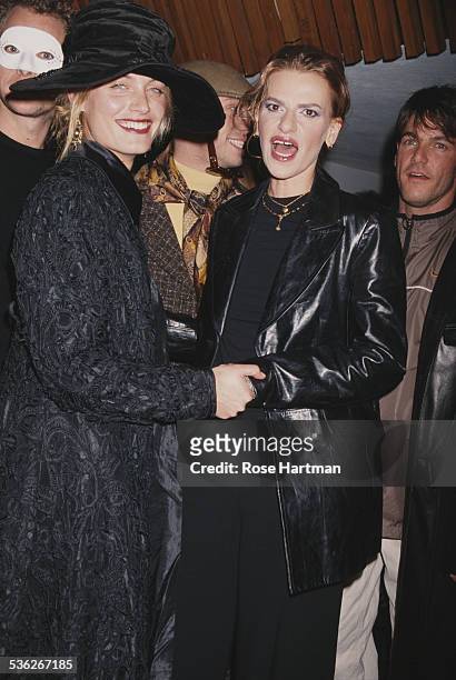 American model Amber Valletta and American comedian Sandra Bernhard attend a 'Visionaire' magazine party in New York City, USA, 1998.