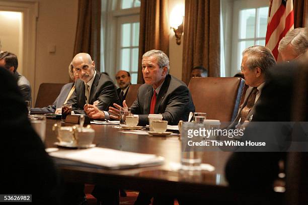 In this handout image provided by The White House, U.S. President George W. Bush , flanked by Michael Chertoff, U.S. Secretary of Homeland Security...