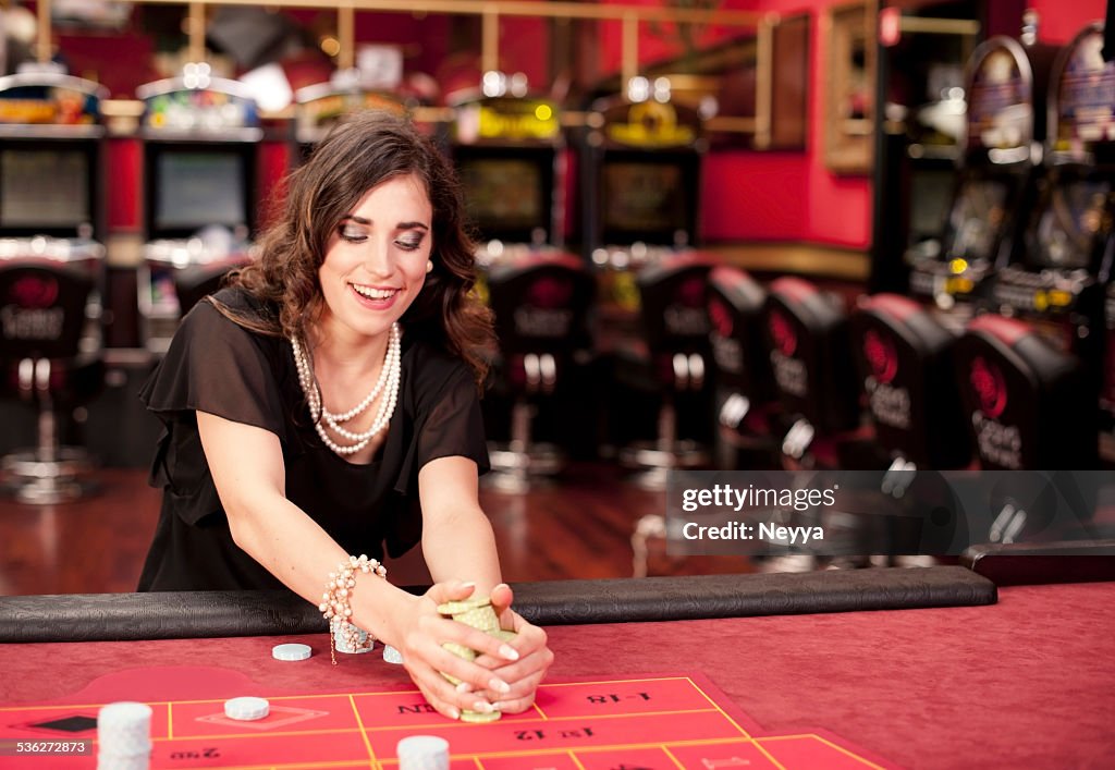 Young Woman Winning at American Roulette Game