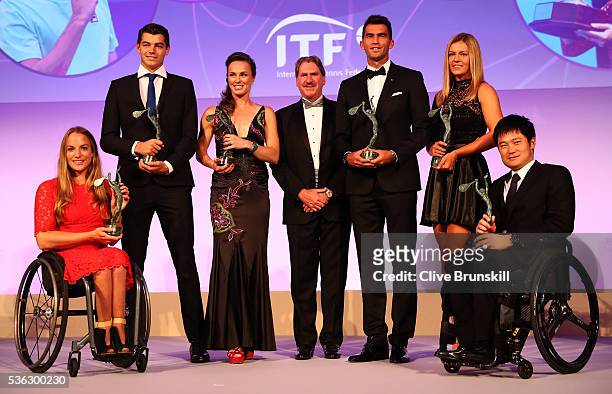 World Champions Jiske Griffioen of Netherlands, Taylor Fritz of the United States, Martina Hingis of Switzerland, ITF President David Haggerty; Horia...