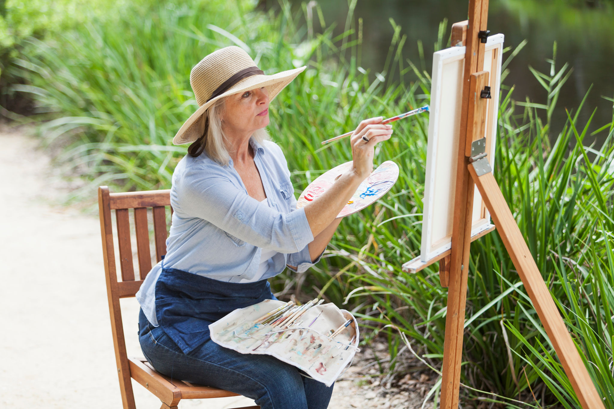 Artist painting nature on canvas Artist painting nature on canvas