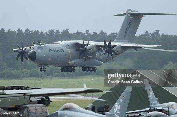 An Airbus A400M military transport plane lands after flying at the ILA 2016 Berlin Air Show on June 1, 2016 in Schoenefeld, Germany. The A400M has...