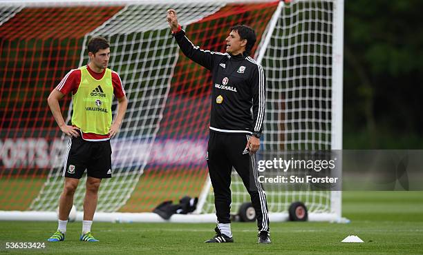 Wales manager Chris Coleman instructs his players as Ben Davies on during Wales training at the Vale hotel complex on June 1, 2016 in Cardiff, Wales.