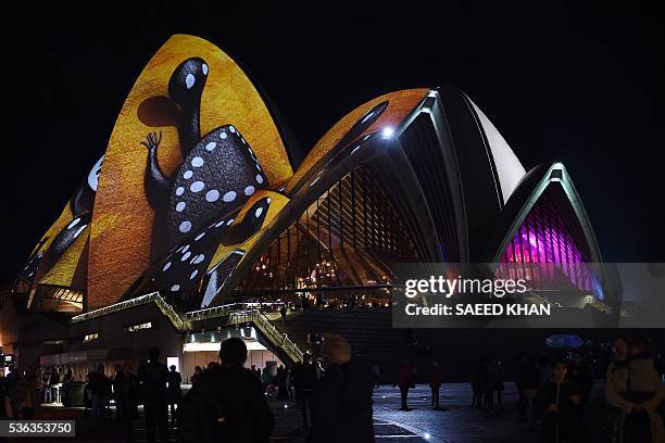 Australia's iconic Opera House is lit up with an art installation called 'Songlines' during the Vivid Sydney festival on June 1, 2016. Vivid Sydney,...