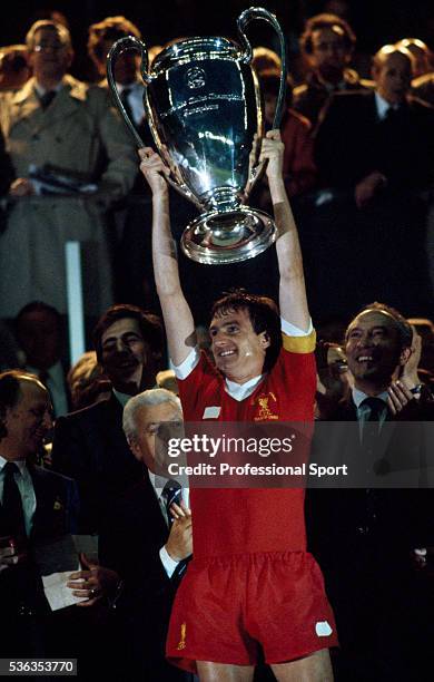Liverpool captain Phil Thompson holds the European Cup aloft after the UEFA European Cup Final between Liverpool and Real Madrid at the Parc des...