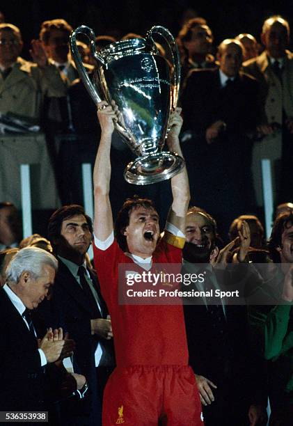 Liverpool captain Phil Thompson holds the European Cup aloft after the UEFA European Cup Final between Liverpool and Real Madrid at the Parc des...