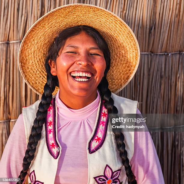 portrait of happy peruvian woman, uros floating island, lake tititcaca - bolivia stock pictures, royalty-free photos & images