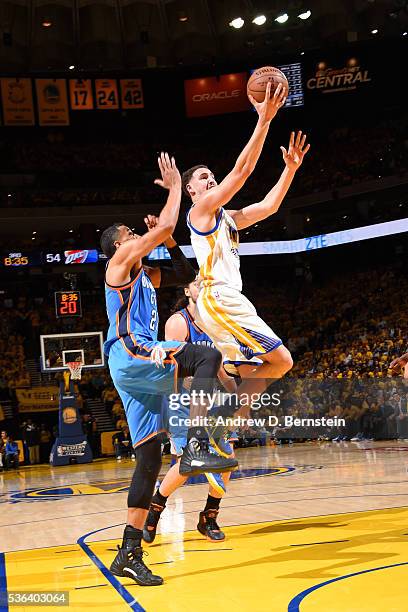 Klay Thompson of the Golden State Warriors drives to the basket against the Oklahoma City Thunder in Game One of the Western Conference Finals during...