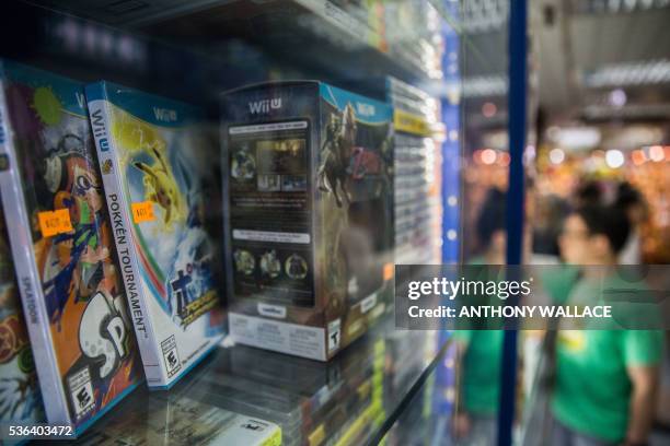 Wii U gaming console game "Pokken Tournament" , with the Pikachu character from Nintendo's Pokemon franchise on the cover, is displayed in a counter...