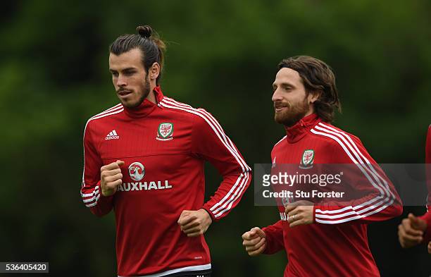 Wales players Gareth Bale and Joe Allen in action during Wales training at the Vale hotel complex on June 1, 2016 in Cardiff, Wales.