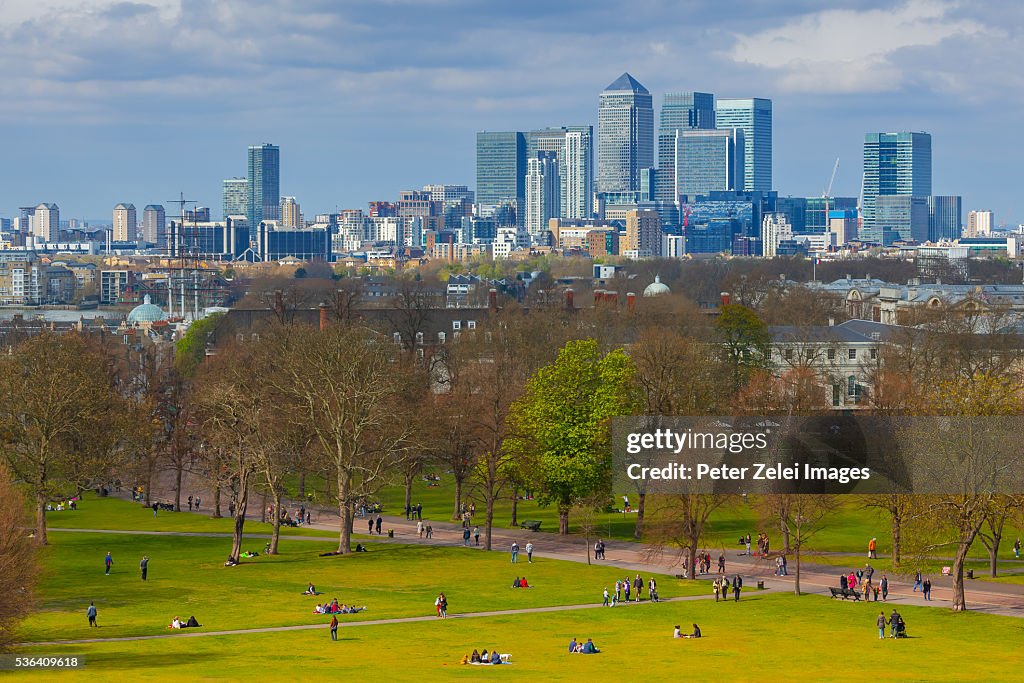 Greenwich park in London with the skyscrapers of Canary Wharf in the background