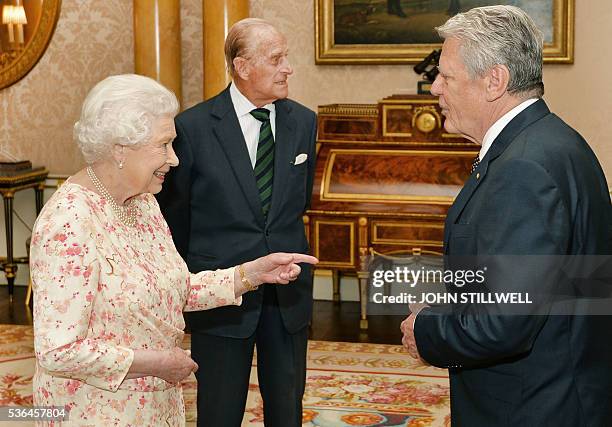 Britain's Queen Elizabeth II , and her husband Britain's Prince Philip, Duke of Edinburgh , greet German President Joachim Gauck during a private...