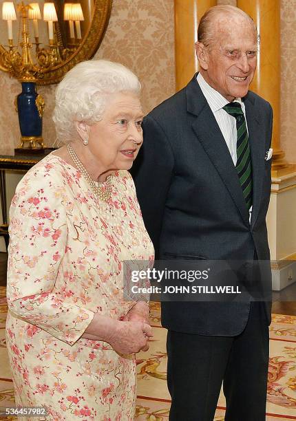 Britain's Queen Elizabeth II , and her husband Britain's Prince Philip, Duke of Edinburgh , react as they greet German President Joachim Gauck during...