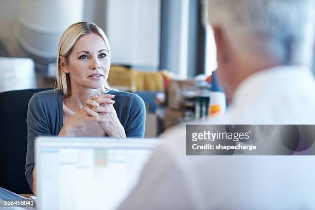 she's nailing this interview - two people talking serious stock pictures, royalty-free photos & images