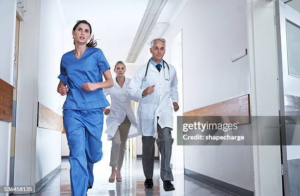 we've got to save him! - female nurse stock pictures, royalty-free photos & images