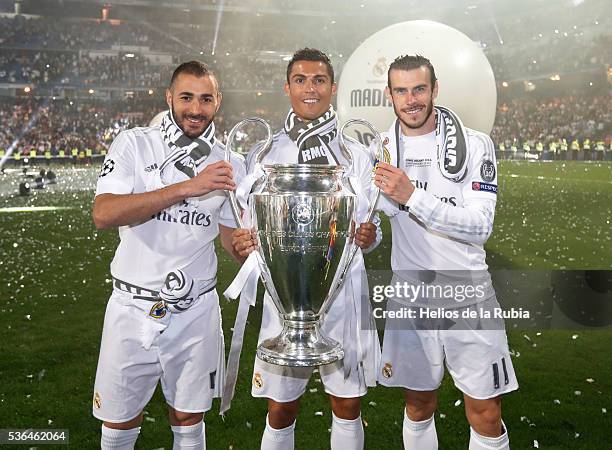 Karim Benzema, Cristiano Ronaldo and Gareth Bale of Real Madrid CF during Real Madrid CF team celebration at Santiago Bernabeu Stadium the day after...