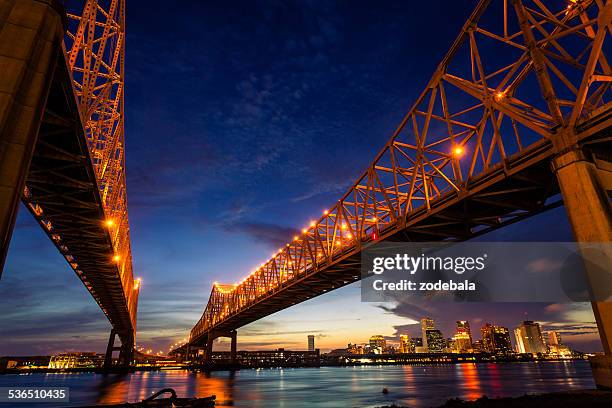 new orleans cityscape at night, louisiana, usa - new orleans bridge stock pictures, royalty-free photos & images