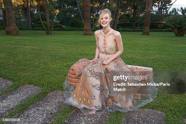 The 23rd gala evening of AmFar . Elle Fanning wearing a dress by Valentino is photographed for Paris Match in Cap d Antibes at the Hotel Cap-Eden-Roc...