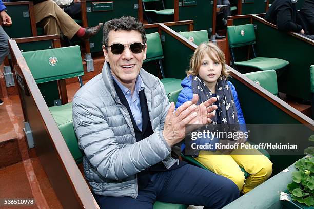 Singer Marc Lavoine and his son Roman attend Day Eleven of the 2016 French Tennis Open at Roland Garros on June 1, 2016 in Paris, France.