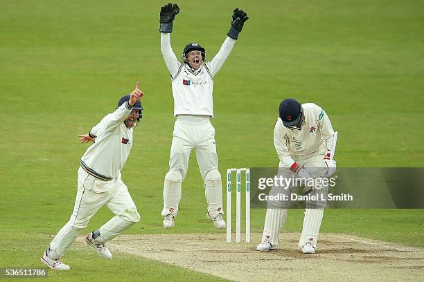 Andy Hodd and Andrew Gale of Yorkshire celebrate as Simon Kerrigan of Lancashire is trapped LBW during day four of the Specsavers County...