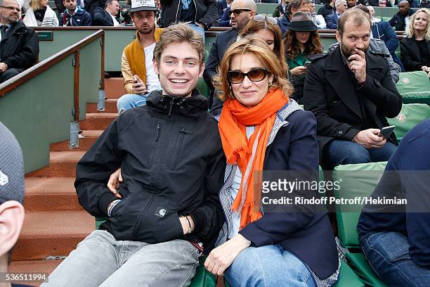 Actress Emmanuelle Devos and his son Raphael attend Day Eleven of the 2016 French Tennis Open at Roland Garros on June 1, 2016 in Paris, France.