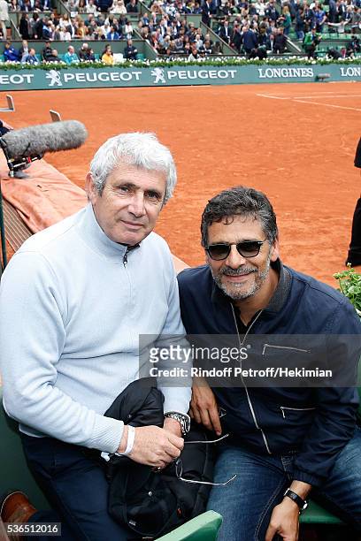 Artistic Director of Ramatuelle Festival, Michel Boujenah and actor Pascal Elbe attend Day Eleven of the 2016 French Tennis Open at Roland Garros on...