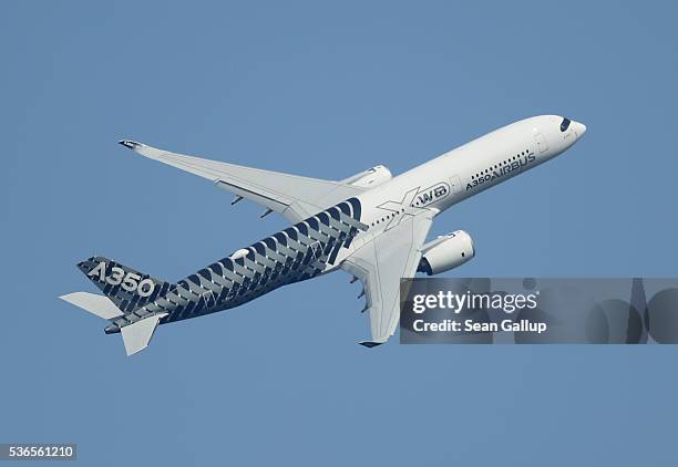 An Airbus A350 flies at the ILA 2016 Berlin Air Show on June 1, 2016 in Schoenefeld, Germany. The ILA 2016 will be open to visitors from June 1-4.