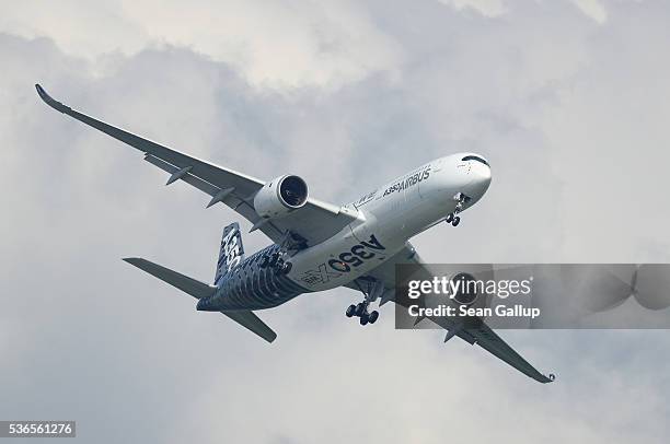 An Airbus A350 passenger plane flies at the ILA 2016 Berlin Air Show on June 1, 2016 in Schoenefeld, Germany. The ILA 2016 will be open to visitors...