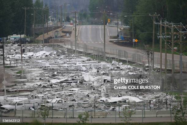 The view of a burned out trailer park inside Fort McMurray, Alberta on June 1, 2016. - Tens of thousands of Fort McMurray residents were expected to...