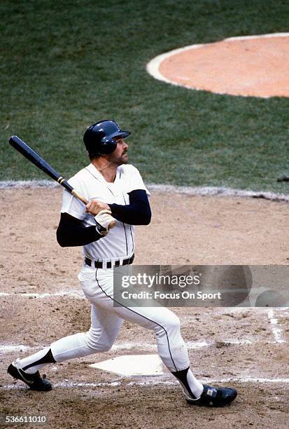 Outfielder Kirk Gibson of the Detroit Tigers swings and watches the flight of his ball as he hits a three run homer off of Goose Gossage of the San...