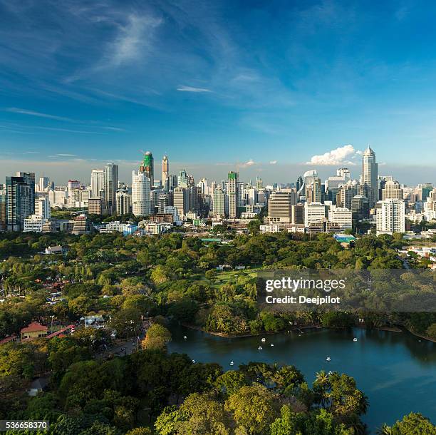 lumphini park and the downtown bangkok city skyline thailand - lumpini park bildbanksfoton och bilder