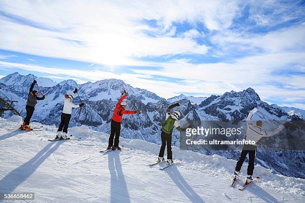 skiing   warm up   happy skier class on the mountain top - happy skier stockfoto's en -beelden