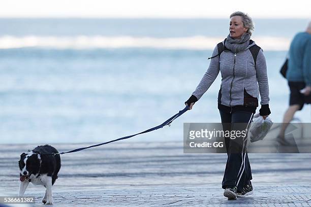 Host of 'The Living Room', Amanda Keller enjoys an evening stroll at Bondi with her dog and son on May 27, 2016 in Sydney, Australia.