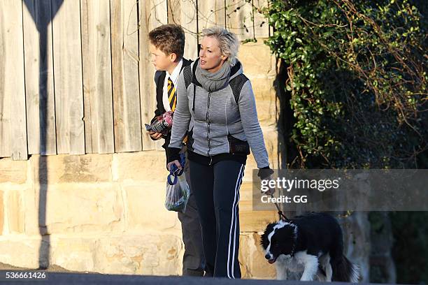 Host of 'The Living Room', Amanda Keller enjoys an evening stroll at Bondi with her dog and son on May 27, 2016 in Sydney, Australia.