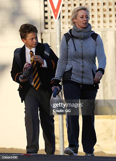 Host of 'The Living Room', Amanda Keller enjoys an evening stroll at Bondi with her dog and son on May 27, 2016 in Sydney, Australia.