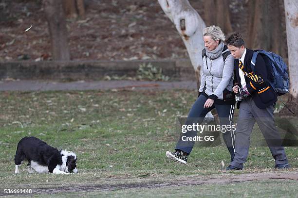 Host of 'The Living Room', Amanda Keller enjoys an evening stroll at Bondi with her dog and son on May 27, 2016 in Sydney, Australia.