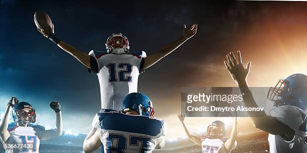 football players celebrate their victory - quarterback stock pictures, royalty-free photos & images