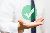 businessman showing virtual approved check mark