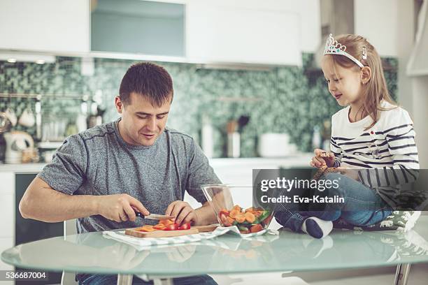 in the kitchen - fathers day dinner stock pictures, royalty-free photos & images