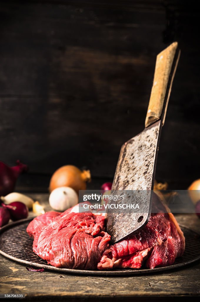 Raw beef meat and flying cleaver