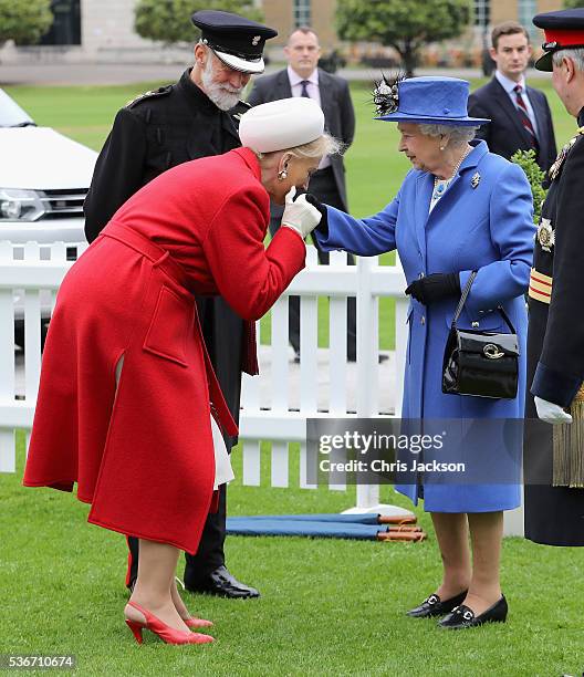 Queen Elizabeth II greets Prince Michael of Kent and Princess Michael of Kent as she arrives at the Honourable Artillery Company on June 1, 2016 in...